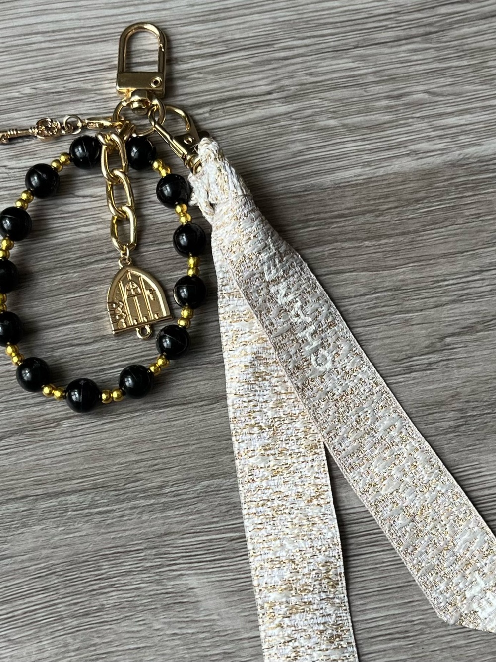 Gold and Black Beaded Keychain with White-Gold Chanel Ribbon